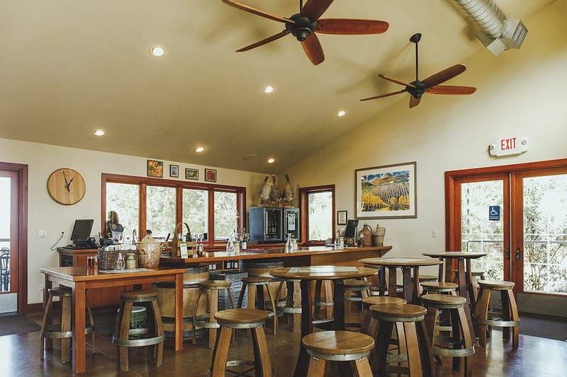 interior of a tasting room with tables and chairs