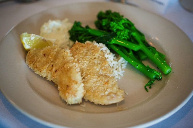 breaded abalone on a plate with broccoli
