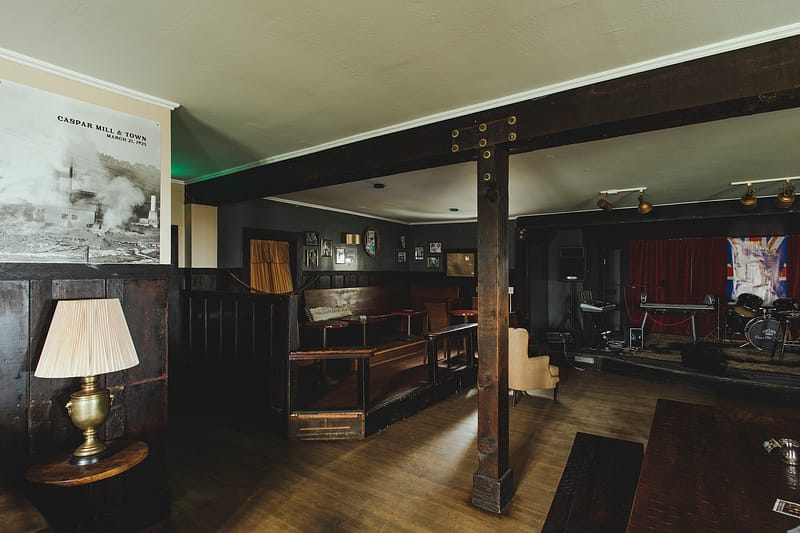 corner of the bar with seating and lamps