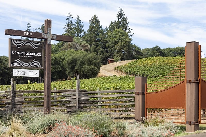 the sign and gate of Domaine Anderson Winery