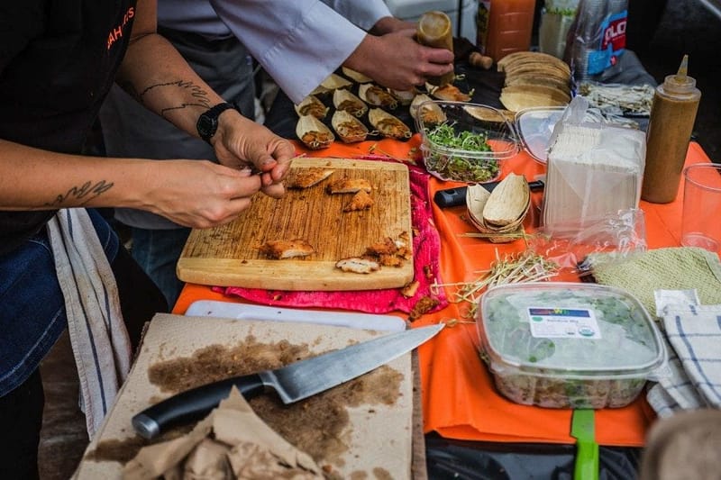 people preparing small bites of abalone