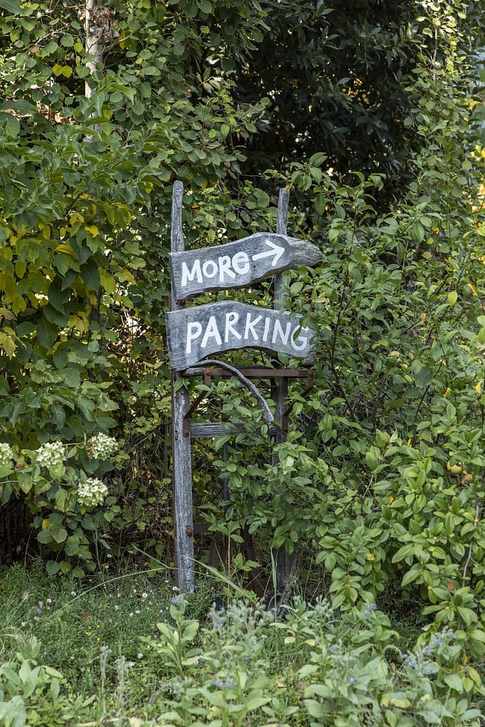 a quirky wooden More Parking sign