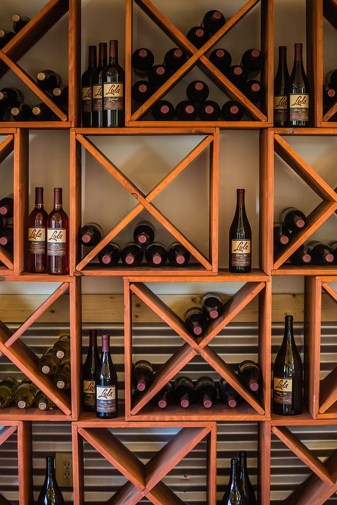 bottles of wine on geometric wooden shelves