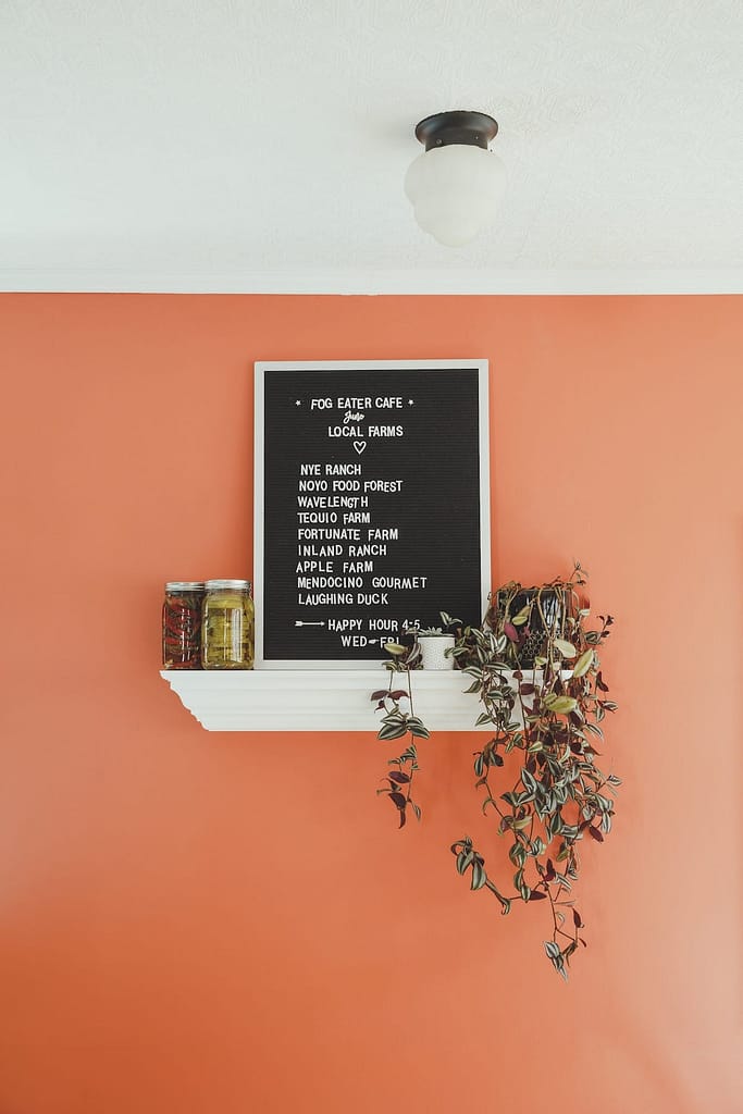 the menu on a red-orange wall