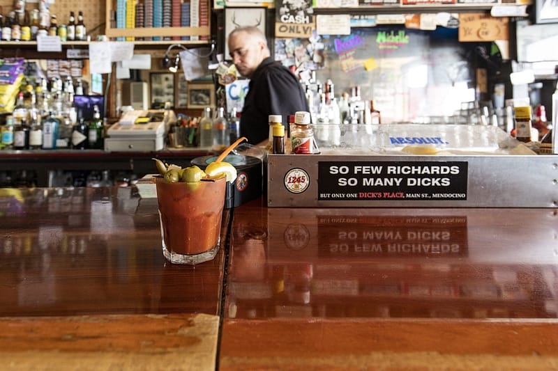 a bloody mary on the wooden bar