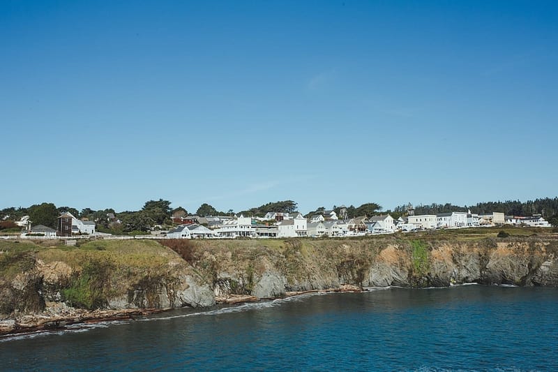 the town of Mendocino above the cliffs and the bay