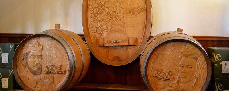 wooden wine barrels with decorative carvings