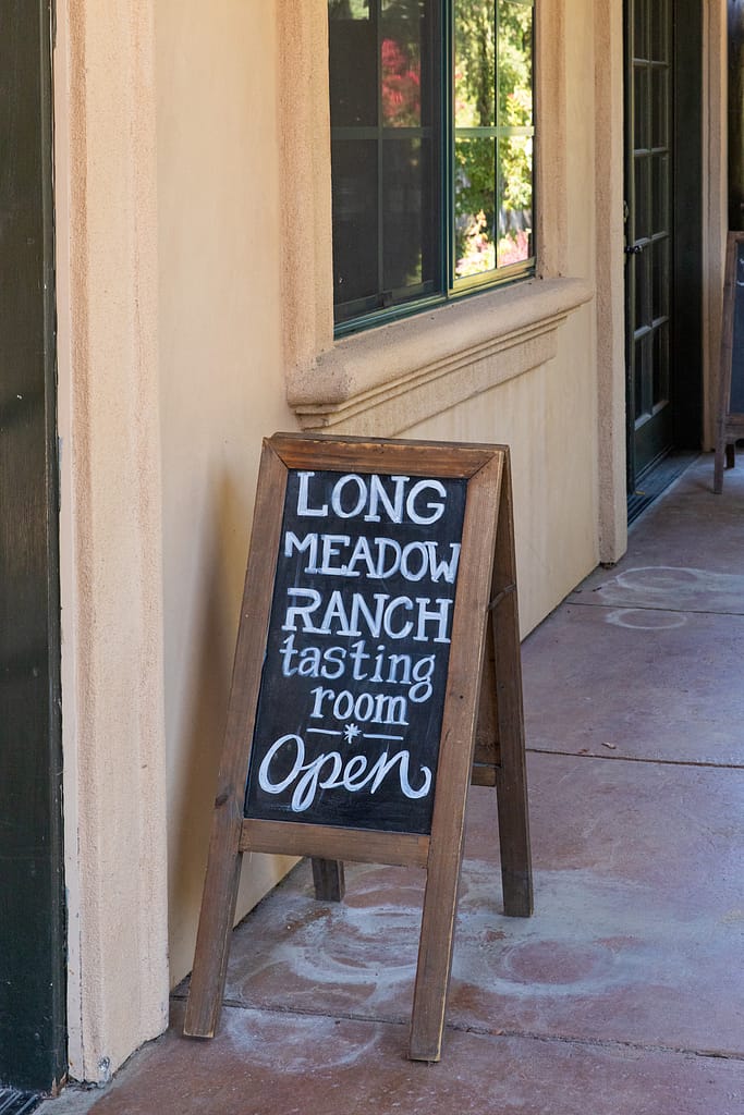 chalkboard tasting room open sign for Long Meadow Ranch