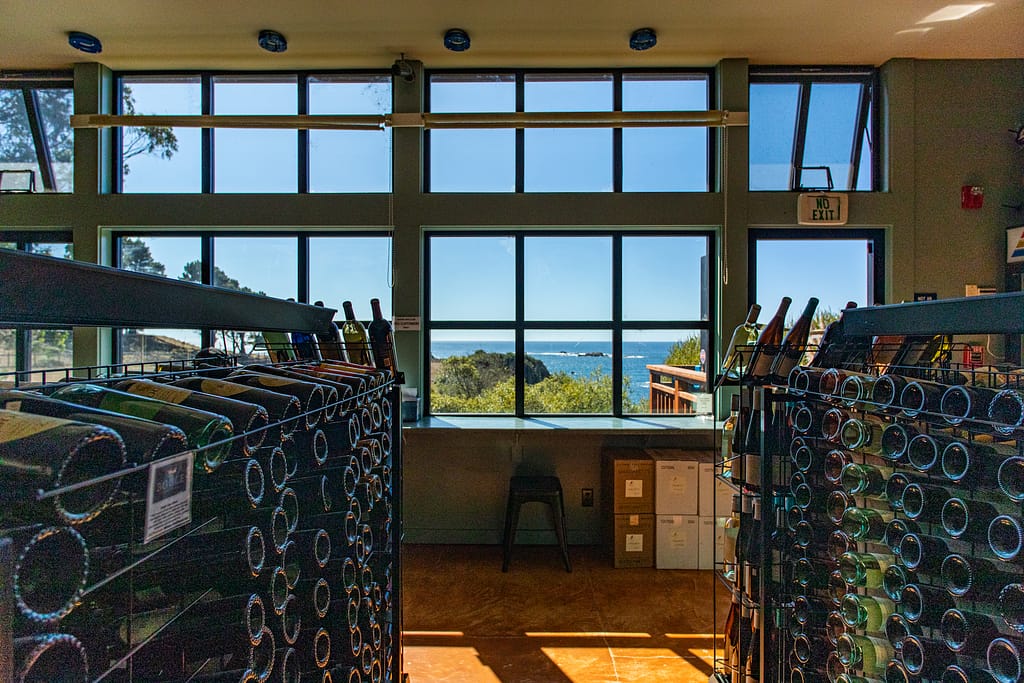 racks of wine and an ocean view from inside Little River Market