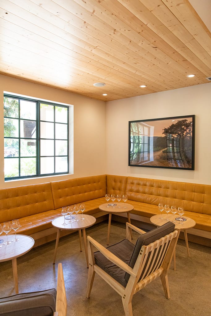 a corner of the tasting room with padded benches