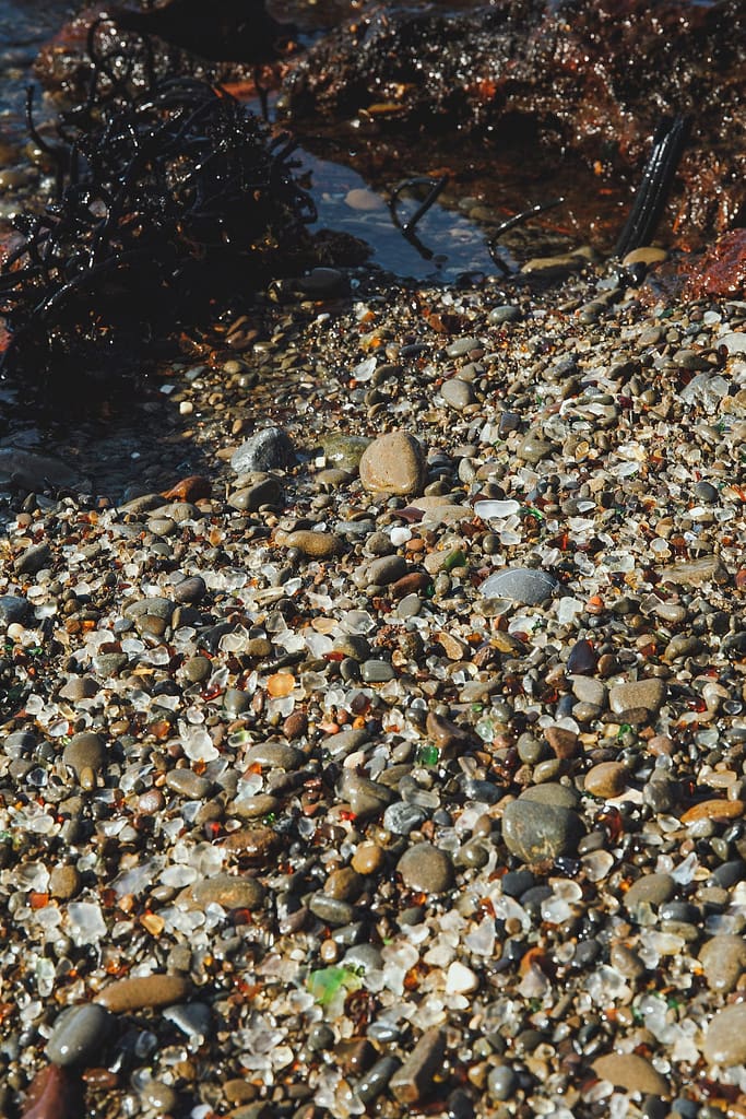 sea glass among rocks on a beach